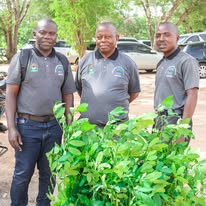 SAHO team members with tree saplings